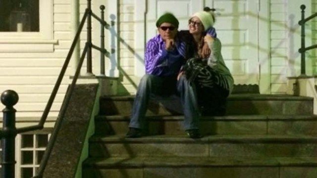 Charlie Sheen and Brett Rossi in front of the former French consulate building in Reykjavik