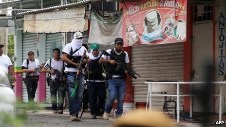 Mexican federal troops will take over security in Michoacán, where vigilante groups and a drugs cartel are clashing
