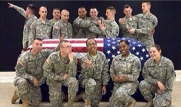 A member of the Wisconsin National Guard was suspended from honor guard duties after she apparently posted this photo to social media
