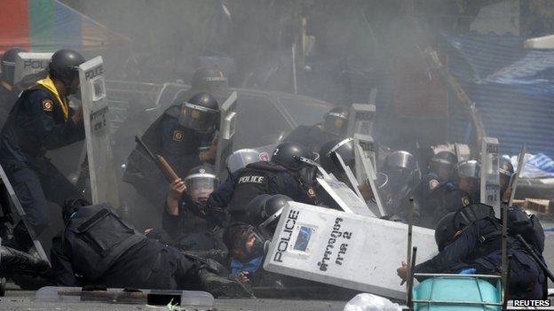 Clashes erupted in central Bangkok on Tuesday with several protesters and police officers injured