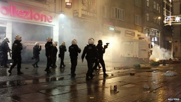 Demonstrators threw fireworks and stones at police cordoning off Taksim Square