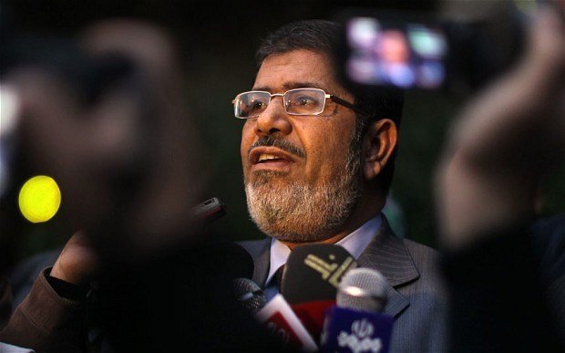 Mohamed Morsi’s lawyers have walked out of his trial on charges of espionage and conspiring to commit acts of terror