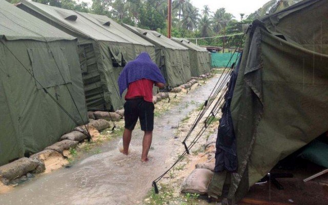 One person has been killed and 77 injured in violence that followed the escape of asylum seekers from an Australian offshore immigration detention center in Papua New Guinea