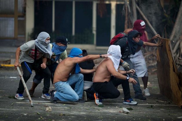 Police and opposition demonstrators have clashed in Venezuela at the end of a march that gathered tens of thousands of people in Caracas