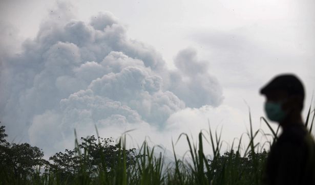 Some 200,000 people are told to evacuate their homes in Indonesia after Kelud volcano erupts on the island of Java