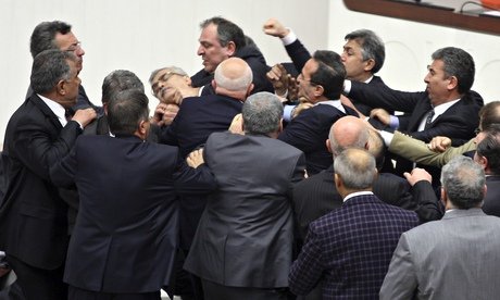 Turkish lawmakers have approved controversial plans to reform the country's top judicial body, amid a brawl which left one opposition legislator with a broken nose