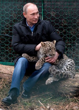 Vladimir Putin has taken senior Olympics officials on a tour of a Persian leopard sanctuary ahead of the Winter Games in Sochi