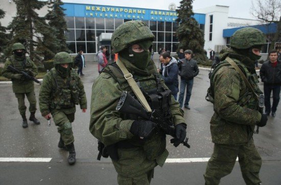 Heavily armed groups continue to occupy key sites in Crimea, including airports and communications hubs