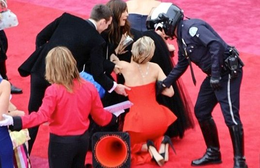 Jennifer Lawrence took a tumble as she made her way down the Oscar red carpet