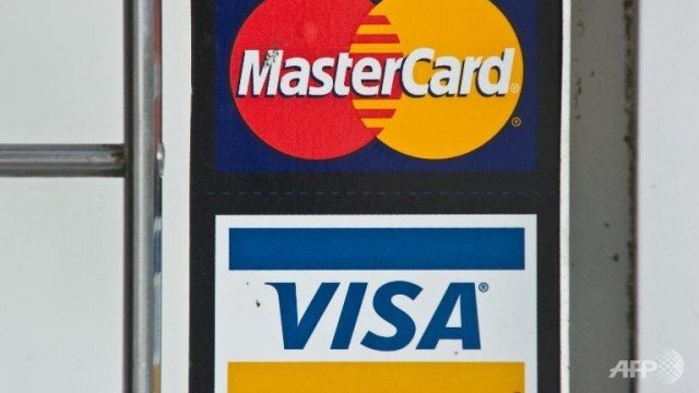 MasterCard and Visa have decided to block credit card services to some Russian bank customers as a result of US sanctions