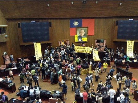 Taiwan's parliament has been occupied by hundreds of students and activists protesting against a trade deal with China and defying police efforts to evict them