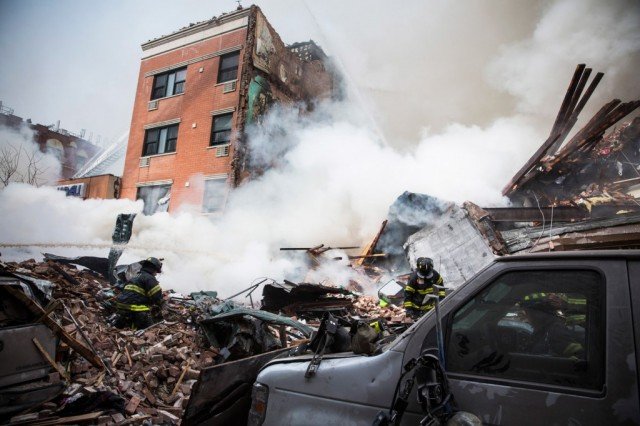 Three people have died and nine are missing after a gas leak sparked an explosion which leveled two buildings in East Harlem