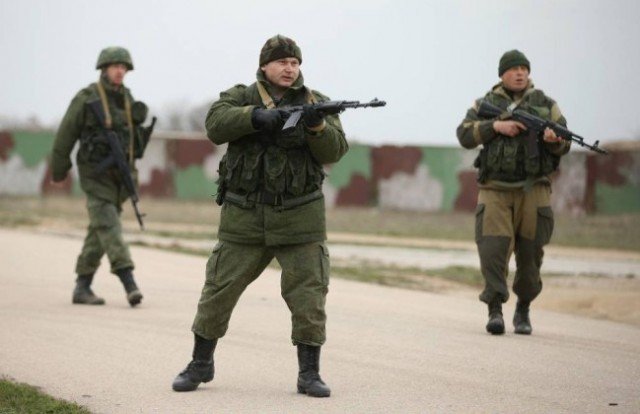Troops wearing Russian uniform without insignia have blockaded military bases since taking control of Crimea last week