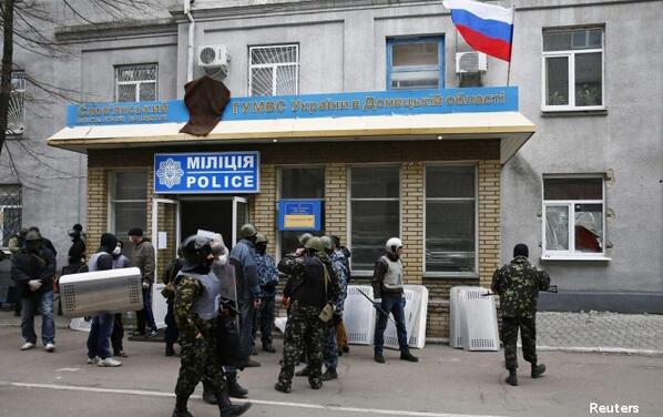 Armed men took over police stations and official buildings in Sloviansk and two other eastern towns