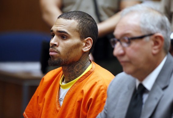 Chris Brown and his bodyguard Christopher Hollosy were arrested in October after a man accused them of punching him outside a Washington hotel