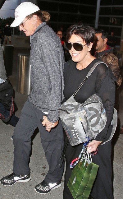 Kris and Bruce Jenner have been spotted holding hands at LAX airport on Wednesday after returning home from Thailand trip