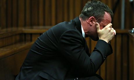 Oscar Pistorius has said he was "besotted" with his girlfriend Reeva Steenkamp, as he gave evidence at his murder trial