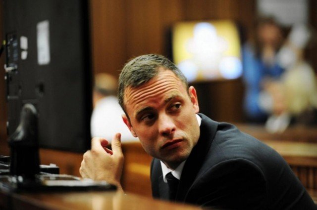 Oscar Pistorius has started his testimony at his murder trial in Pretoria by apologizing to the family of his girlfriend Reeva Steenkamp