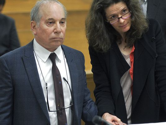 Paul Simon and Edie Brickell holding hands at court hearing in Norwalk