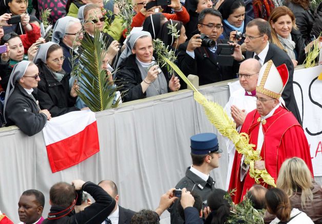 Pope Francis marked Palm Sunday in a packed St. Peter's Square ignoring his prepared homily