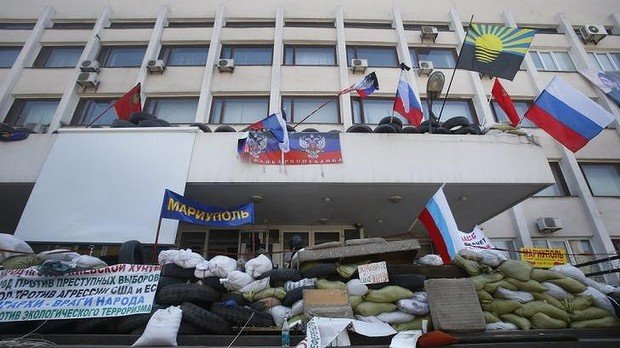 Ukraine’s government announces it has regained control of the city hall in the eastern port of Mariupol from pro-Russian separatists
