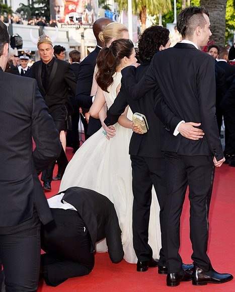 A man was arrested at the Cannes Film Festival after he tried to slip his head under America Ferrera's gown