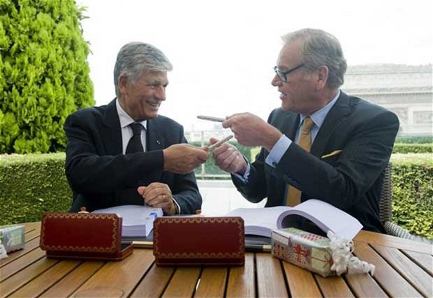 Last July, Omnicom's chief executive John Wren was pictured signing the deal on the roof of the Paris headquarters of Publicis with its CEO Maurice Levy