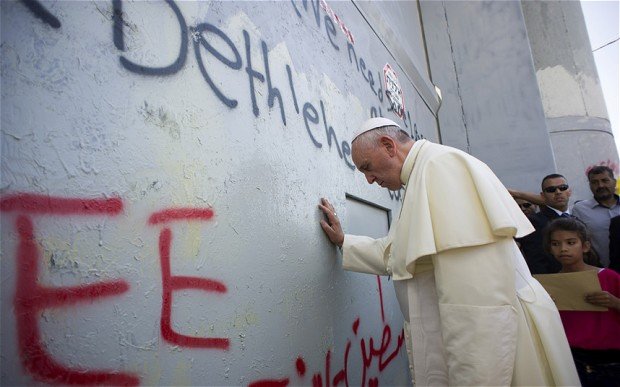 Pope Francis has prayed at Bethlehem wall during his three-day tour of the Middle East