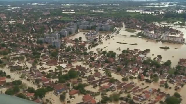 Serbia and Bosnia call for international help to rescue people from flooded areas after the worst flooding since modern records began