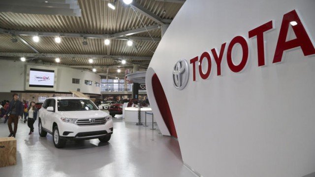 Toyota has seen its profits nearly double, boosted by the Japanese yen's weakness and cost cutting