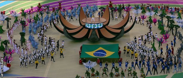 A cast of 660 dancers paid tribute to Brazil's nature, people and football with a show around a living ball on the Arena de Sao Paulo pitch