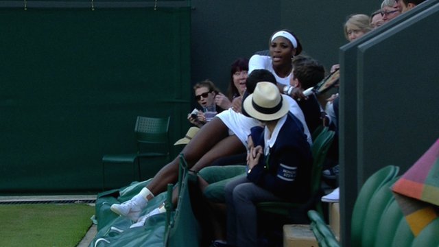 Serena Williams ran out of space during her Wimbledon double match and fell into the lap of a spectator
