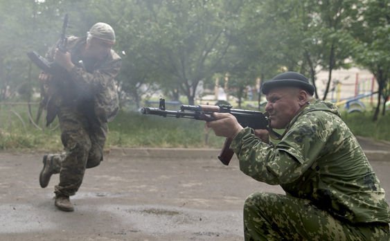 Two Ukrainian military bases in the eastern region of Luhansk have been taken by separatist rebels as fighting continues near the rebel-held town of Sloviansk