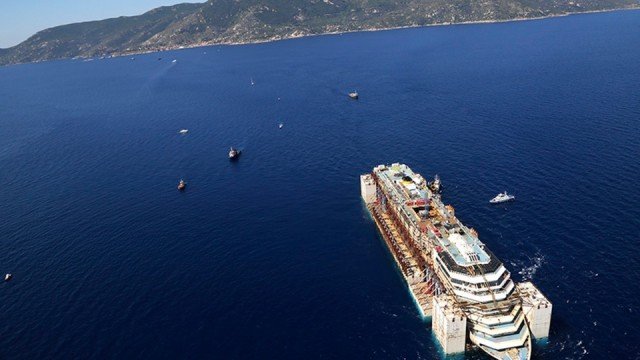 Costa Concordia is about to arrive in the port of Genoa for scrapping after a two-year salvage operation