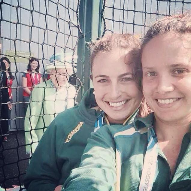Queen Elizabeth II popped up in the background as two Australian Commonwealth Games hockey players were posing for a selfie