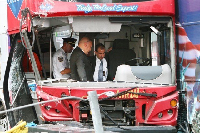 One of the two drivers involved in the double-decker tour bus crash in Times Square was arrested and charged with DWAI