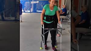 Paralyzed swimmer Amy Van Dyken-Rouen is walking for the first time with the help of bionic legs