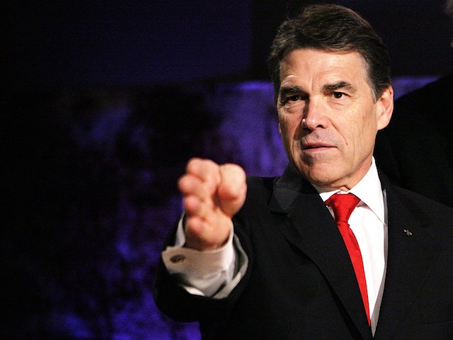 Rick Perry plans to turn himself in to authorities for fingerprinting and a mug shot