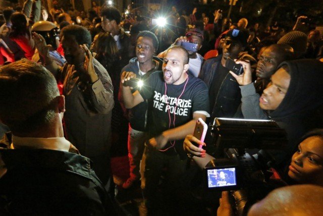 Angry crowds on Shaw streets after an off-duty police officer fatally shot a black teenager