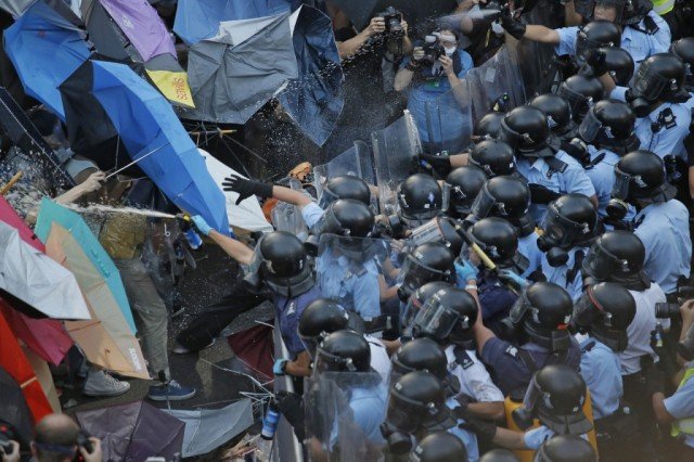 Hong Kong protesters have retaken streets in the Mong Kok district cleared by the authorities just a few hours earlier