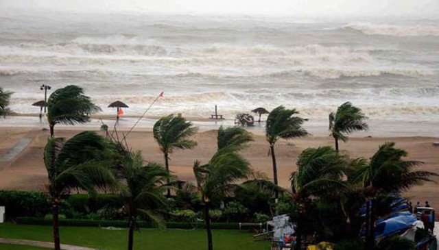 Hundreds of thousands of people are evacuated as Cyclone Hudhud pounds the eastern Indian coast