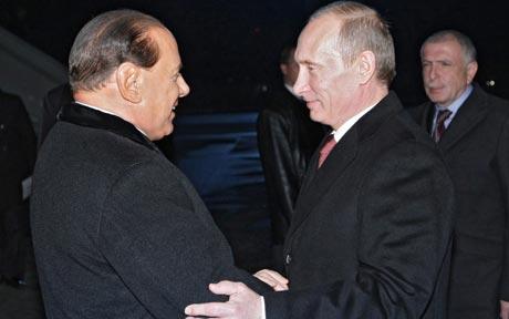 President Vladimir Putin has paid a late-night visit to former Italian PM Silvio Berlusconi during ASEM summit in Milan