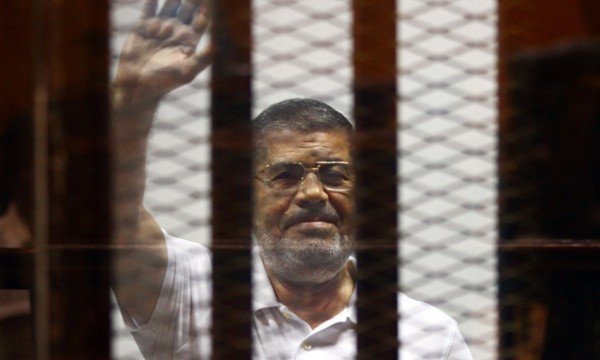 Egypt's former president Mohamed Morsi inside a glass cage during his trial in Cairo earlier this ye