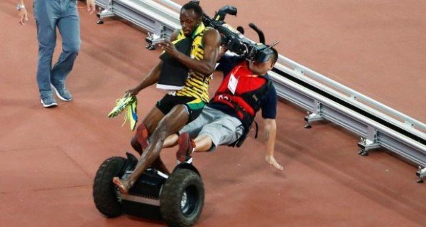 Usain Bolt and segway riding cameraman